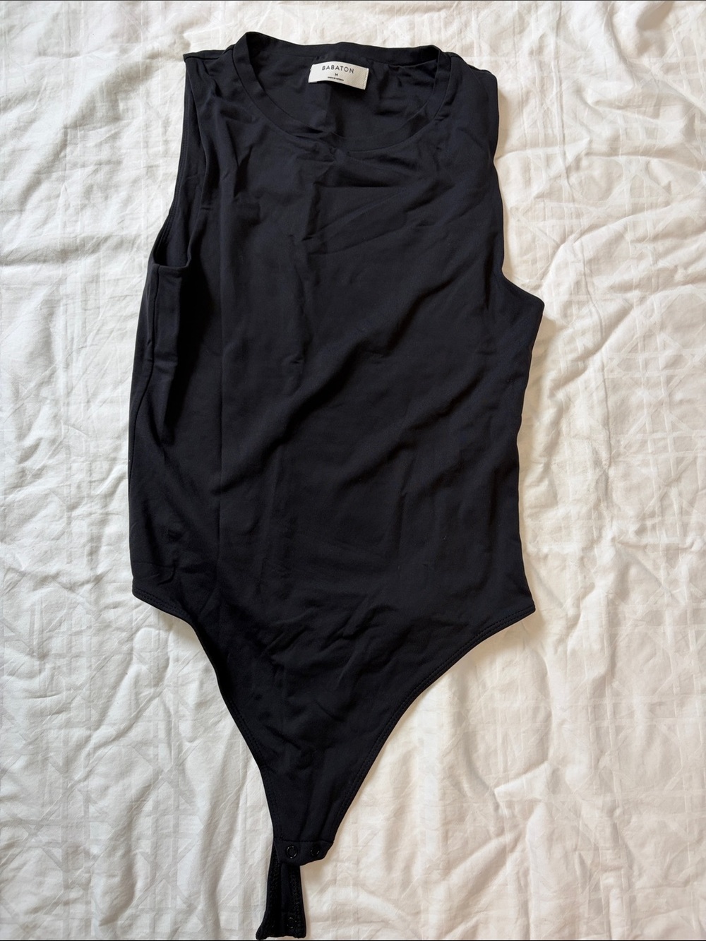 Babaton Black Sleeveless Bodysuit with Snap Closure